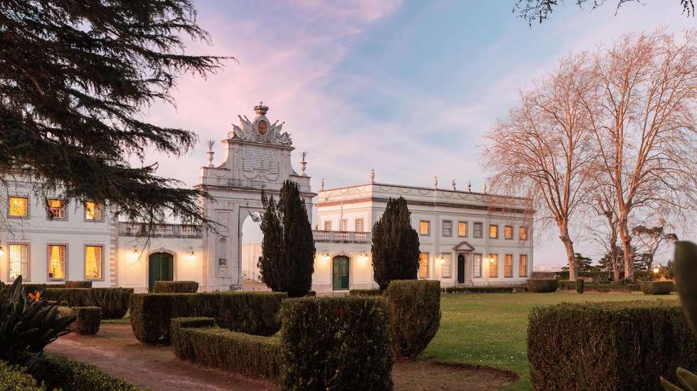 Palácio de Seteais neoclassical façade at dusk with formal gardens