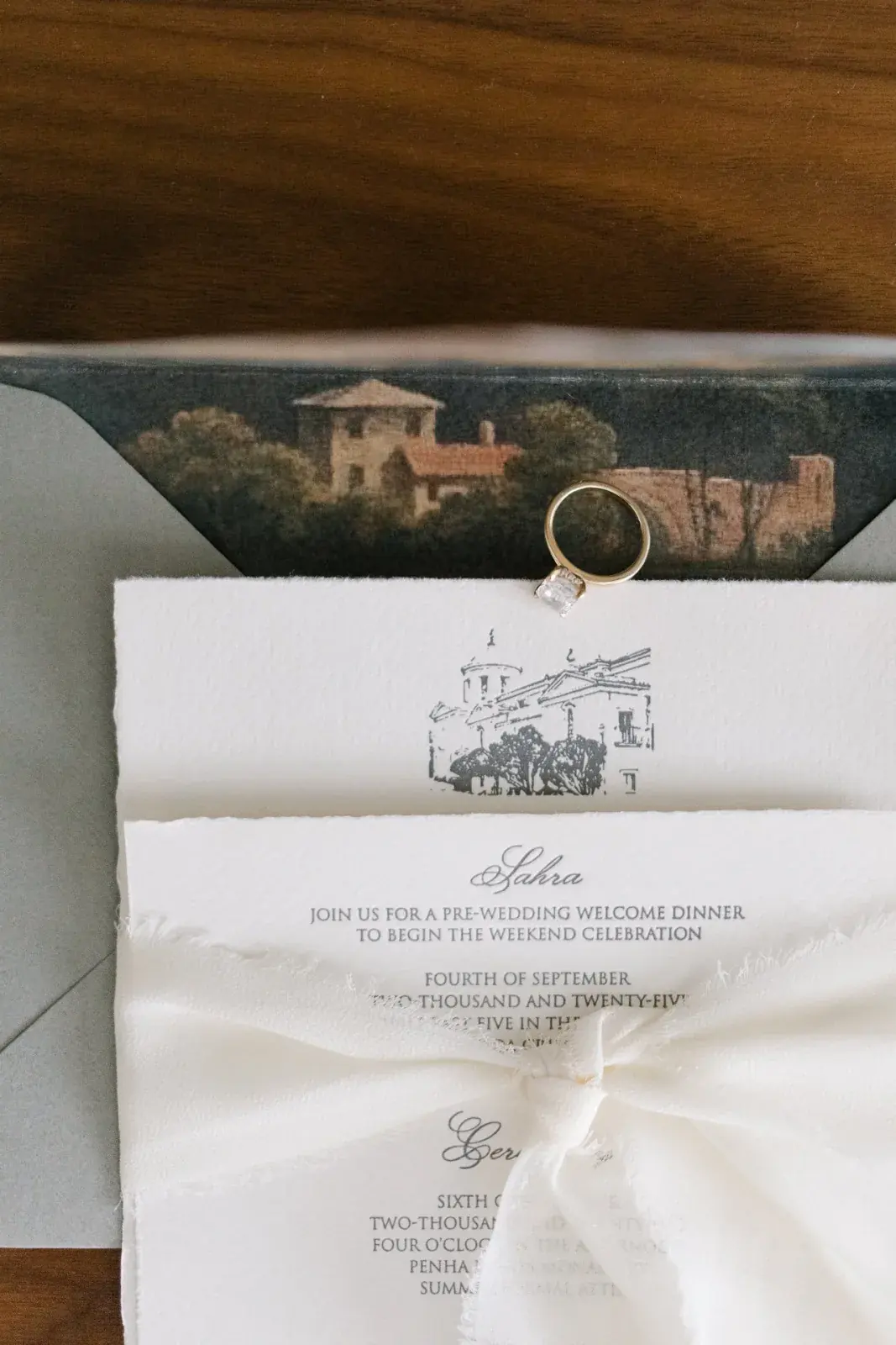 Letterpress invitation suite for a welcome dinner and ceremony, venue sketch and engagement ring above