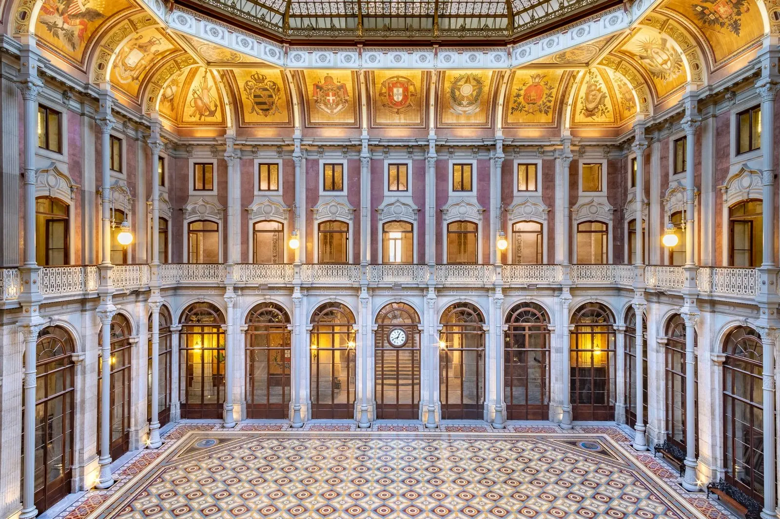 The Pátio das Nações at Palácio da Bolsa in Porto, prepared for a wedding dinner beneath the octagonal glass dome.