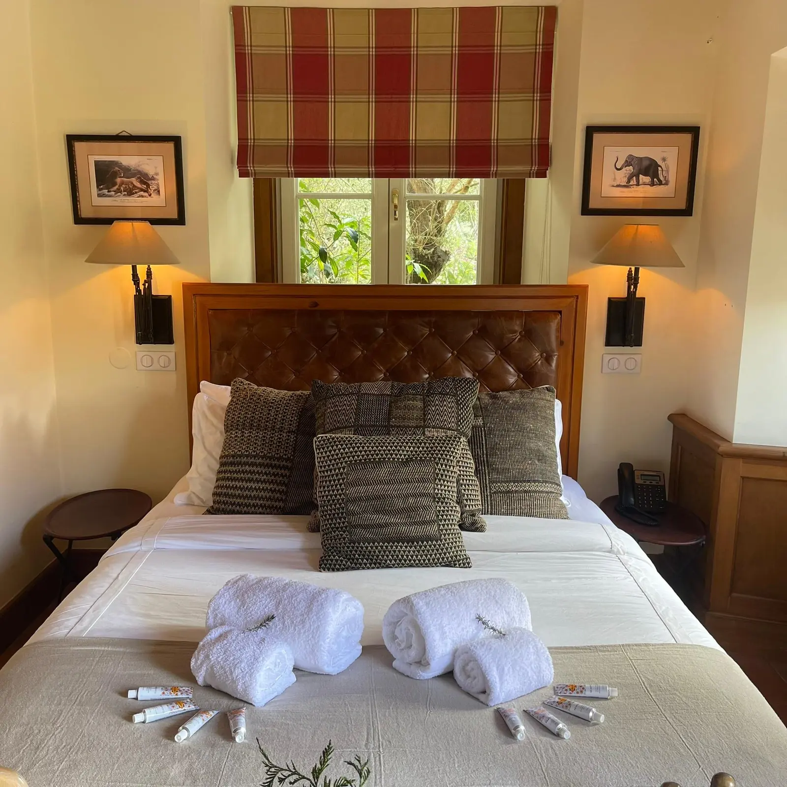 Bedroom suite at Quinta da Bella Vista with tartan headboard and twin lamps