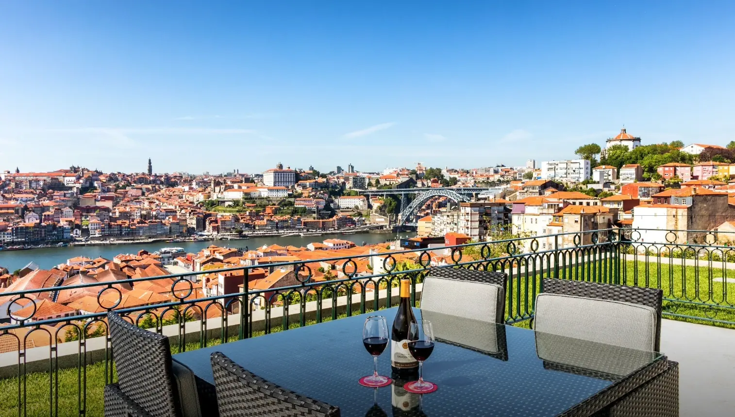 The Yeatman bridge-view terrace set for an intimate alfresco wedding dinner with the Luiz I Bridge over the Douro, Vila Nova de Gaia, Porto